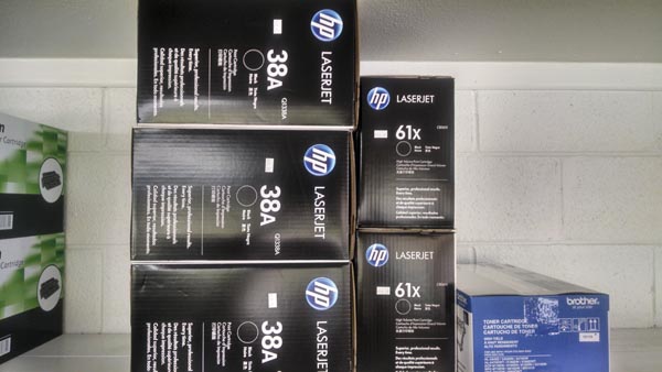 Stacks of HP LaserJet toner cartridges